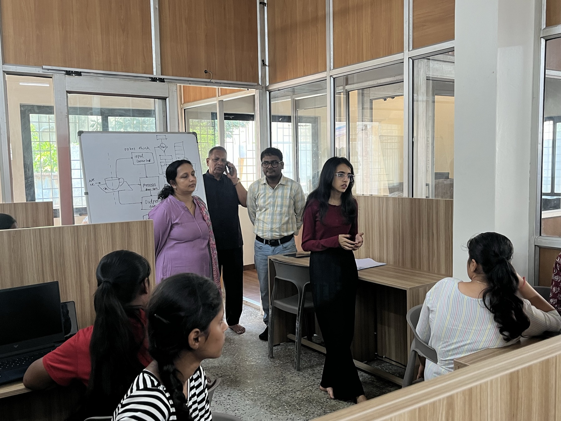 A student presenting an engineering idea to the MindforgeAI cohort